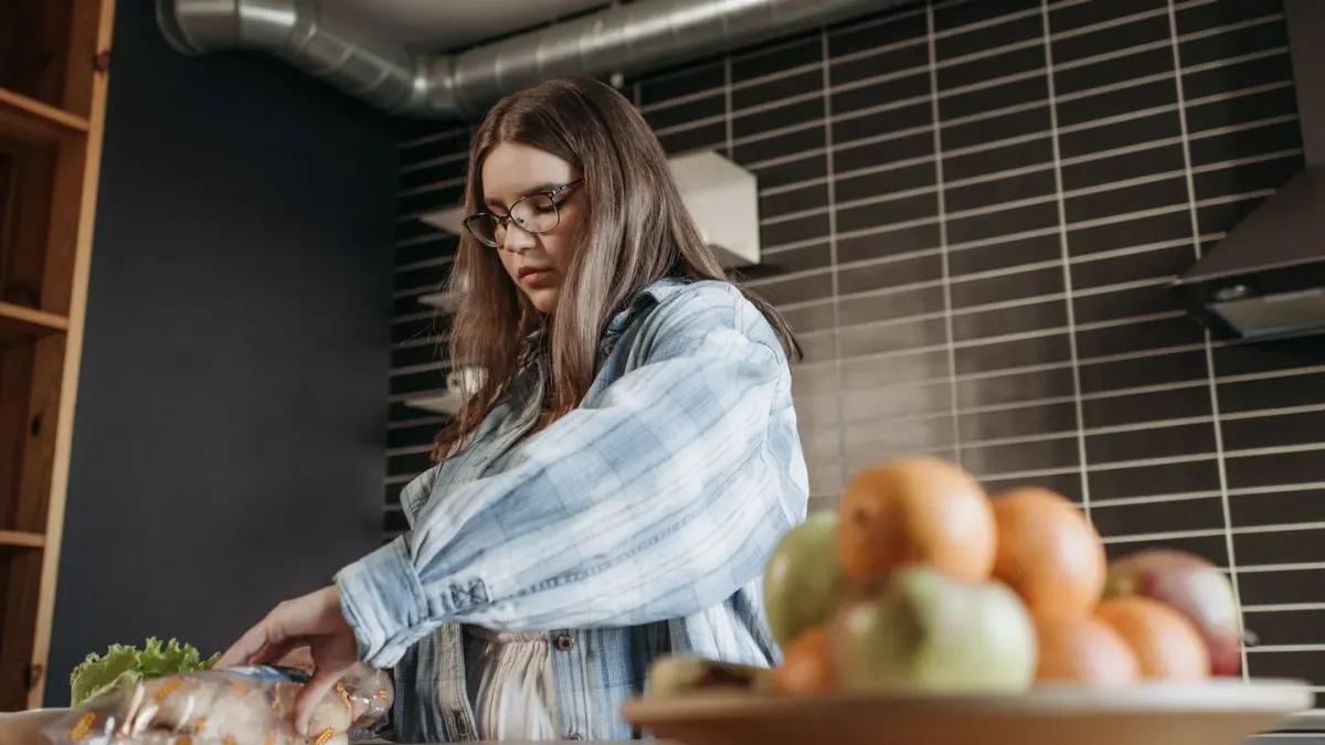 Dog owner preparing a meal
